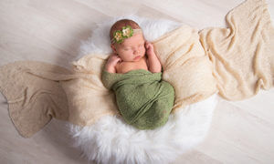 Newborn Photography captured at JCPenney Portraits featuring our new wraps. 