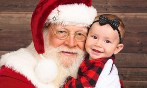 Santa Picture with child captured at JCPenney Portrait Studio. 
