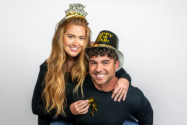 Couple posing for New Year photos at JCPenney Portraits.