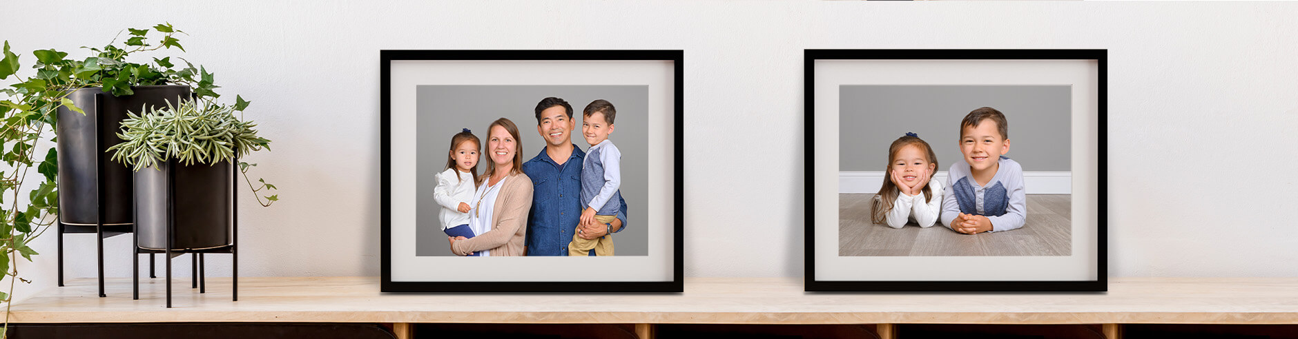 Family photography is showcased on framed prints within the home.