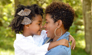 Loving mom and daughter captured during their outdoor family photography session.