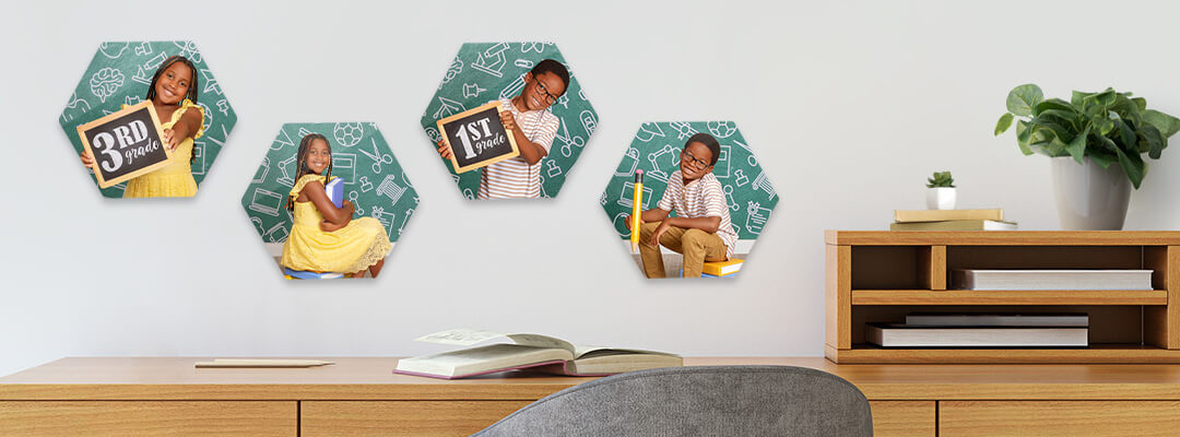 Metal photo tiles displayed on a wall, featuring back to school photography at JCPenney Portraits.