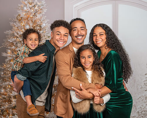 Family photographed on new Winter Window holiday background