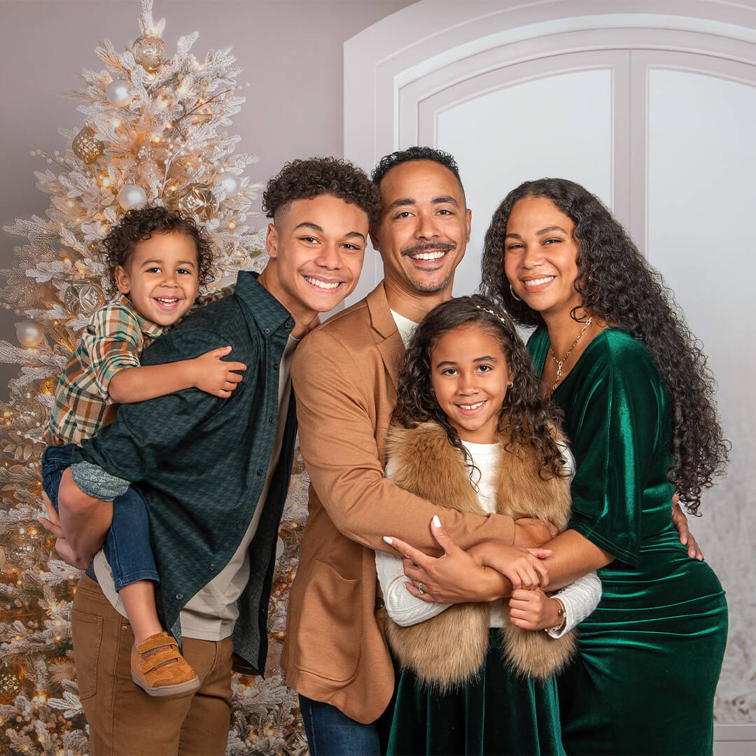 Family photographed on Winter Winder holiday background