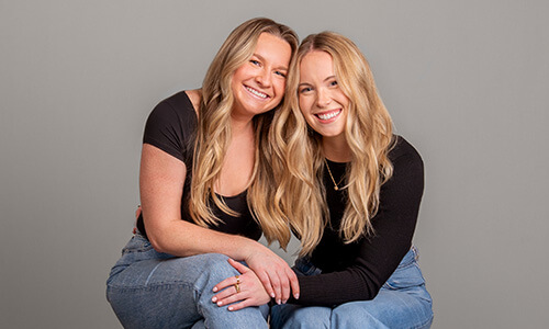 Two best friends in matching outfits taking bestie photos at JCPenney Portraits