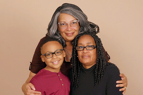 Grandma, mom, and son image. Generation photography captured at JCPenney Portraits.