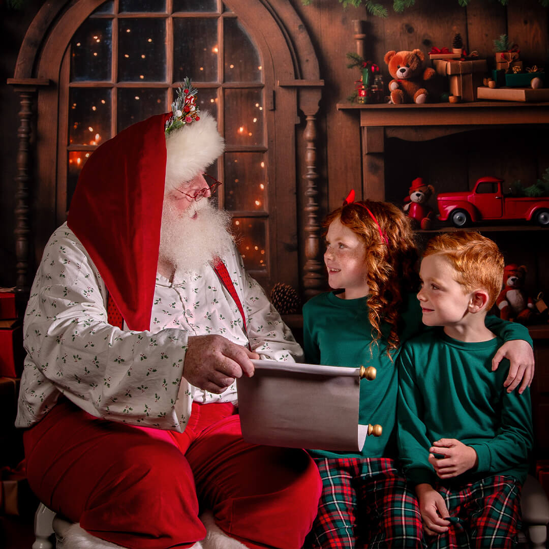 Siblings taking Santa photos.