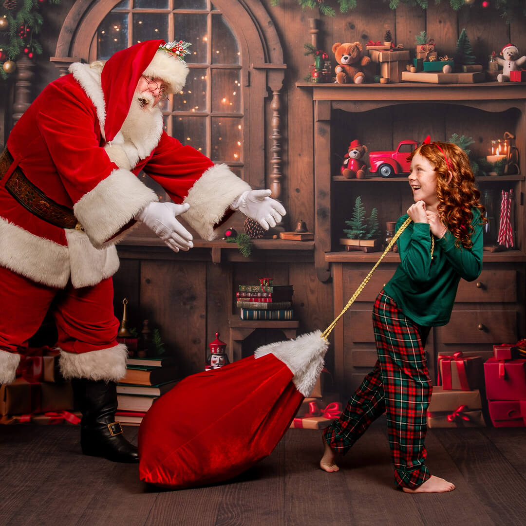 Child posing for pictures with Santa.