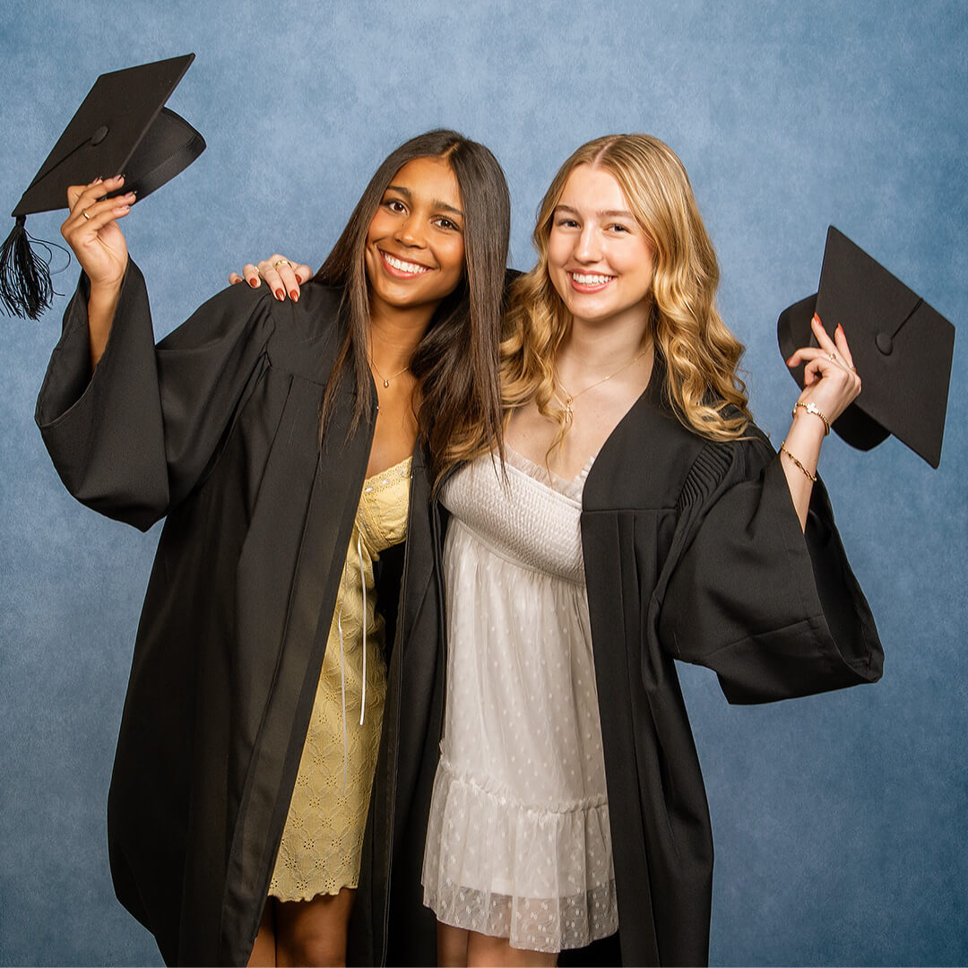 Best friends taking graduation pictures.