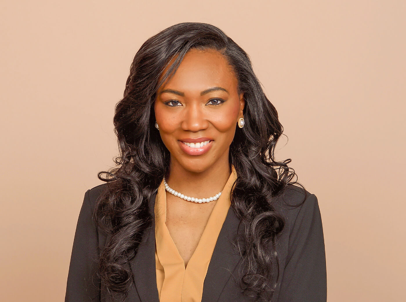 Woman in a black blazer for business headshot photos.