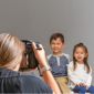 Photographer capturing family photos at JCPenney Portraits.