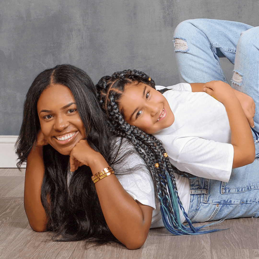 Mother's Day photo session for a mom and her daughter in white shirts and jeans.