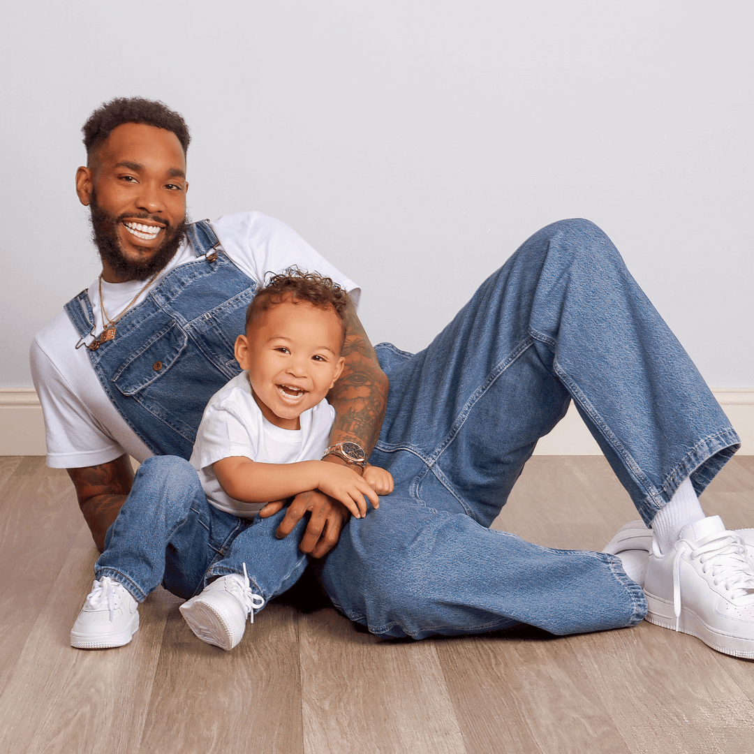 Father and son in matching denim outfits for Father's Day photos.