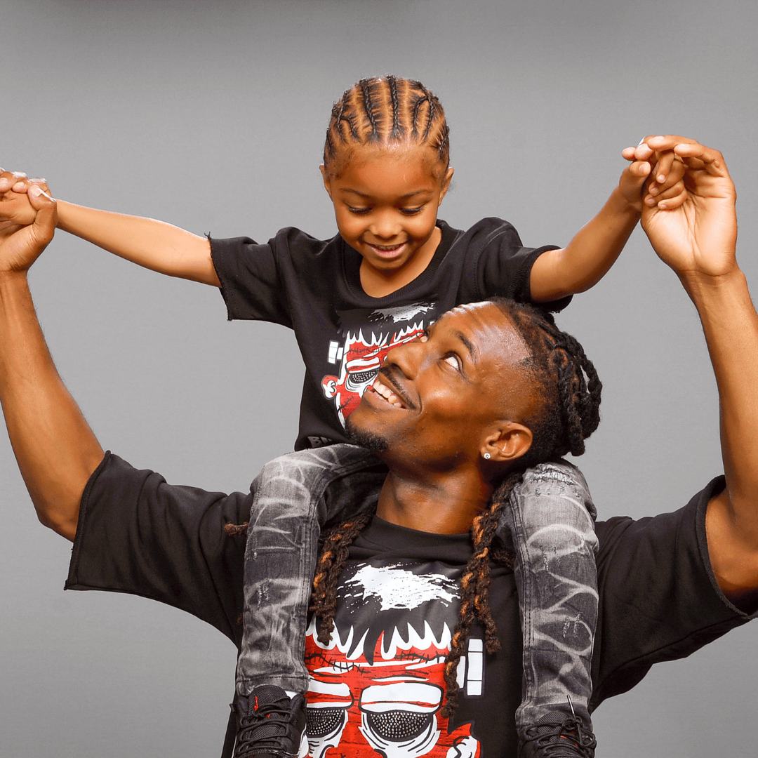 Father and son in matching t-shirts for Father's Day photography.