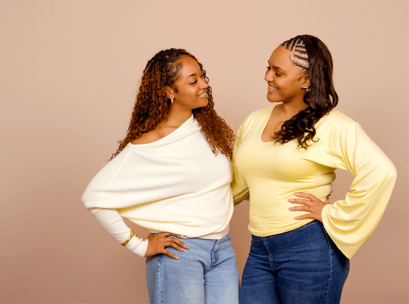 Two women posing for a friendship photoshoot at JCPenney Portraits.