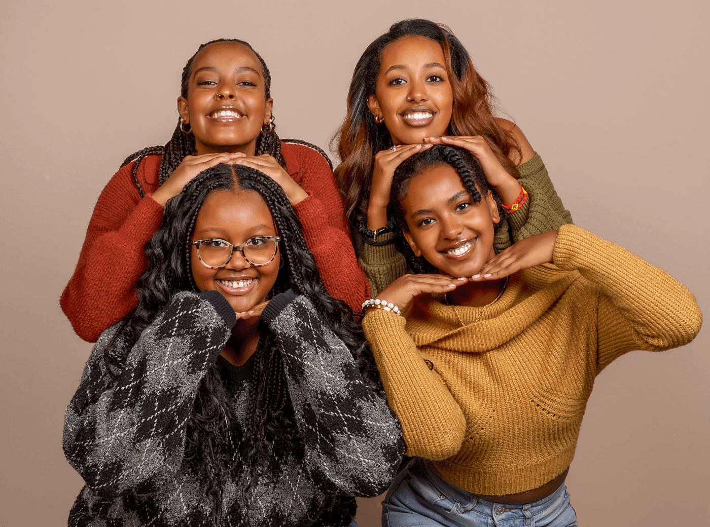A group of women smiling for a friendship photoshoot at JCPenney Portraits.
