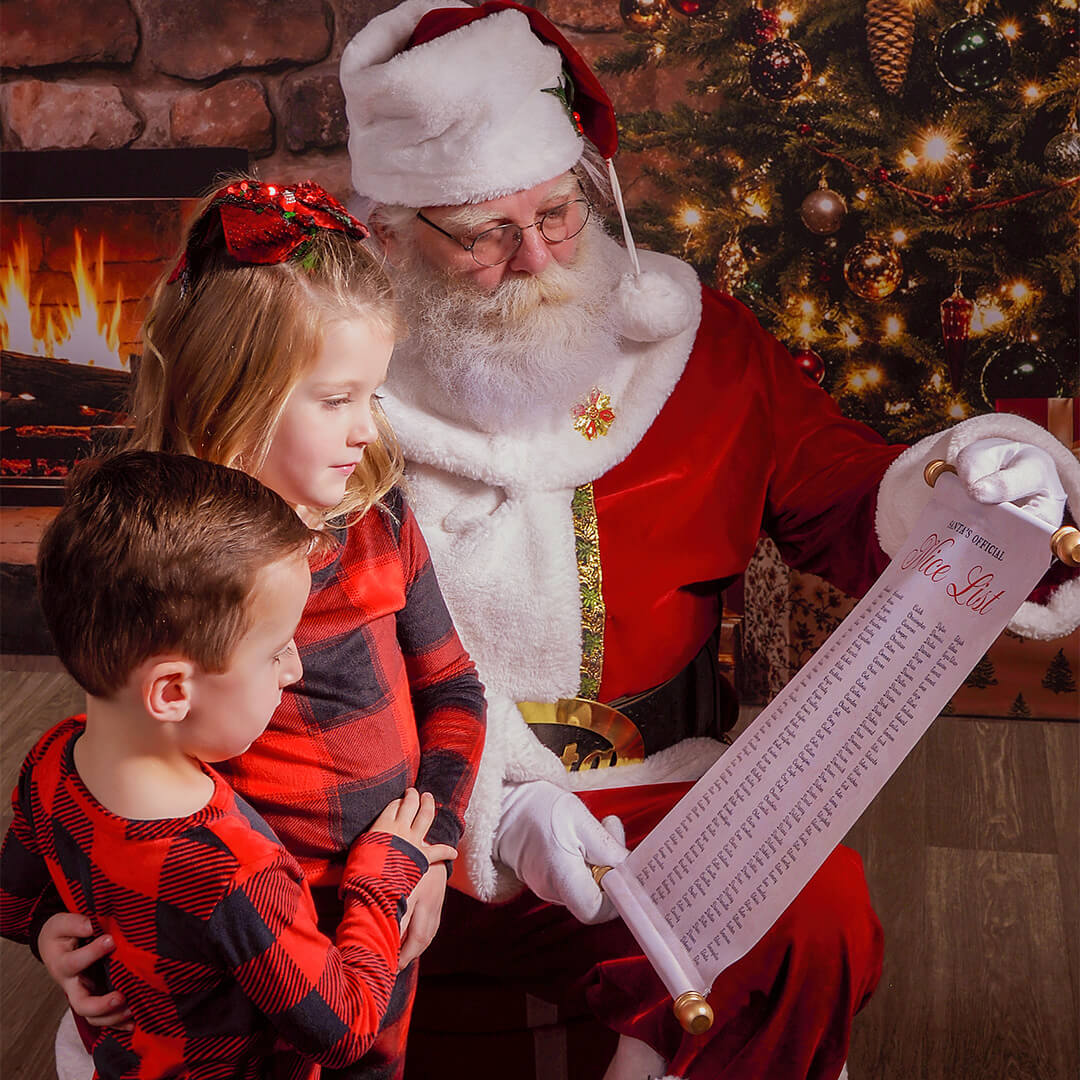 Children reading Santa's list for Santa pictures at JCPenney Portraits.